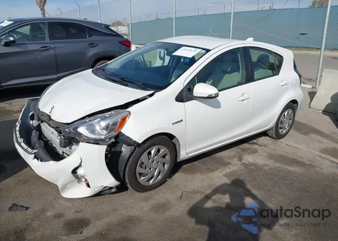 2015 Toyota Prius C One from USA, damaged, VIN JTDKDTB31F1584417